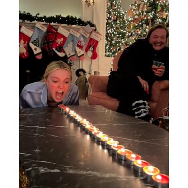 Dakota and Elle Fanning get in on Christmas candle challenge