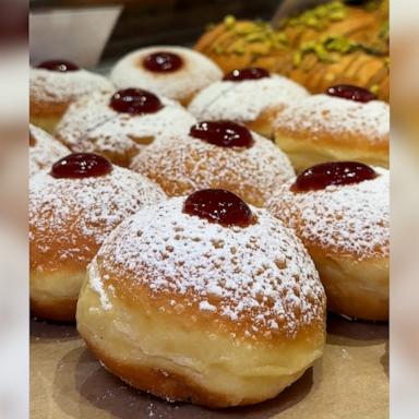 ‘Breads Bakery’ in New York City keeps the tradition of commemorating fried food for Hanukkah by making their creative assortment of jelly donuts for the holiday.