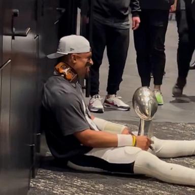 Philadelphia Eagles quarterback Jalen Hurts shared a candid moment with the Lombardi Trophy after the Eagles beat the Kansas City Chiefs 40-22 in Super Bowl LIX.