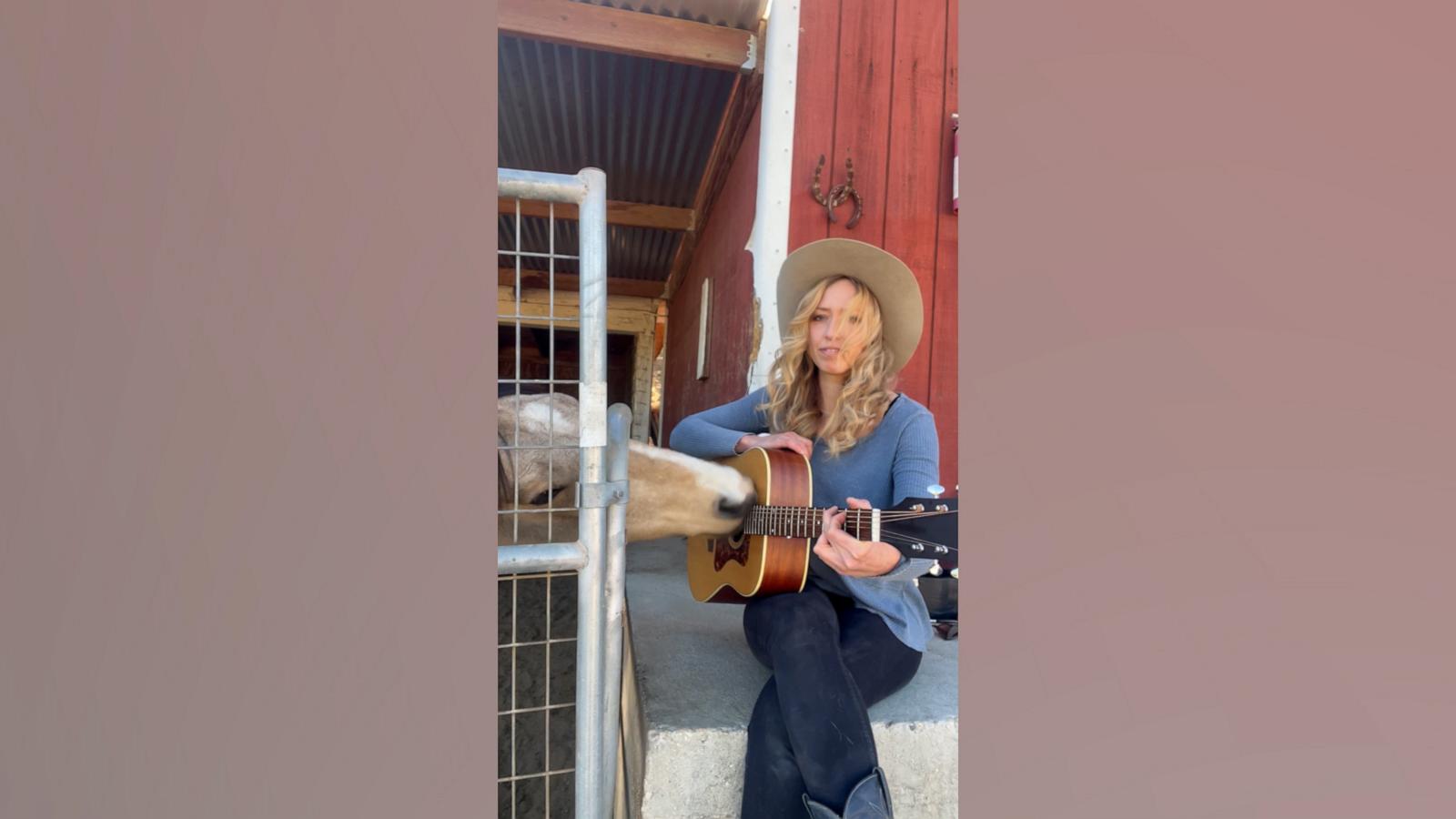 Yupia loves to practice the guitar with musician Mikayla Khramov at the horse rescue farm where he lives.