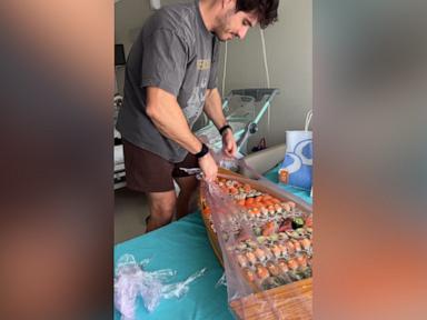 WATCH:  Dad surprises his wife with huge sushi boat after she gives birth