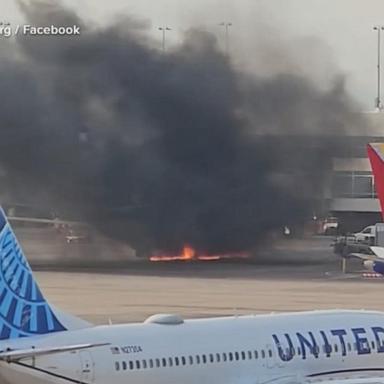 VIDEO: American Airlines plane catches fire at Denver Airport