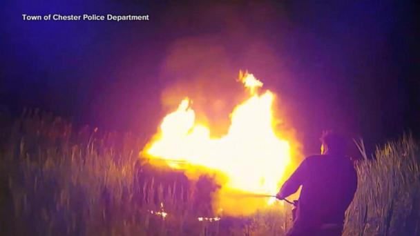 Good Samaritan and officers save woman from burning car