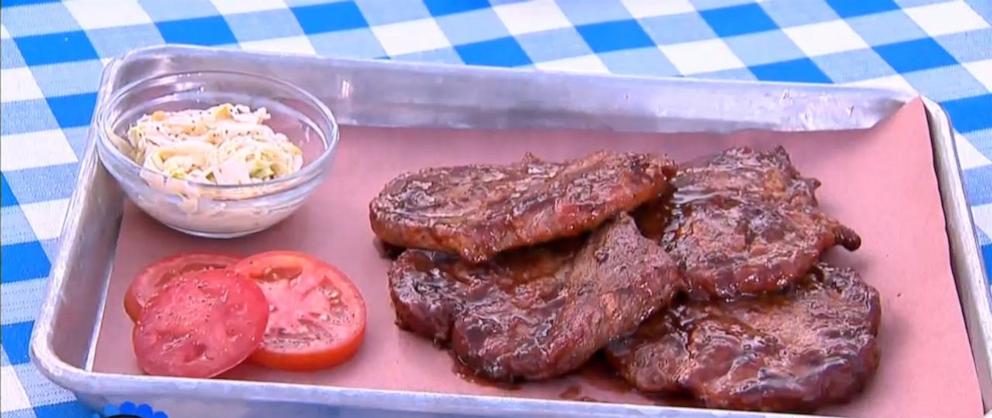 PHOTO: A tray of smoked pork steaks with comeback coleslaw.