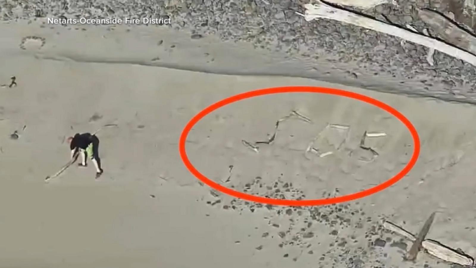 WATCH:  Stranded tourists spell ‘SOS’ on Oregon beach