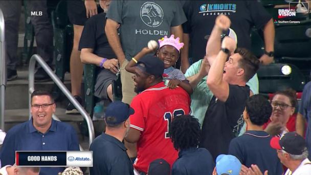 Birthday girl shows off her arm after catching home run at Braves game