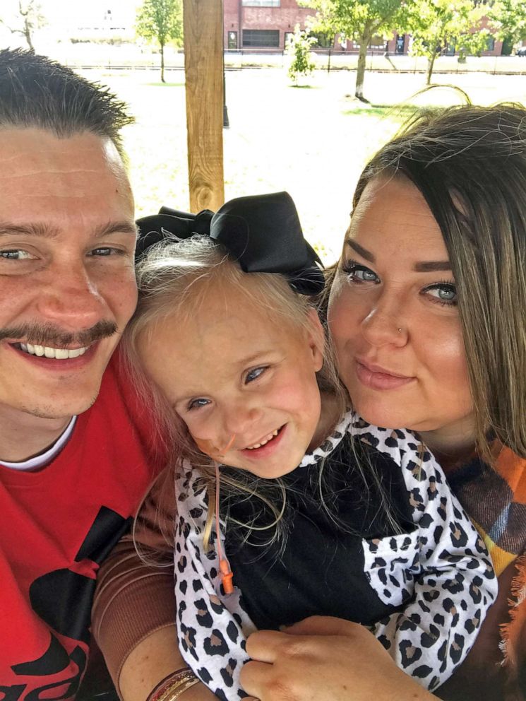 PHOTO: Kayleigh Kulage, 5, poses with her parents Josh and Desiree Kulage.
