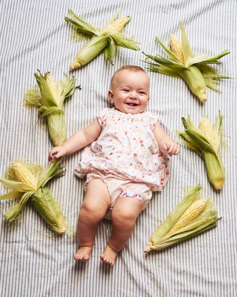 PHOTO: Michaela Claire Meter at six months old with six ears of corn.