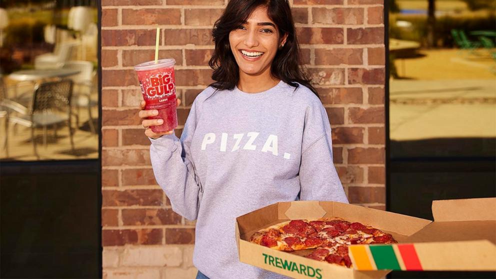 PHOTO: A 7-Eleven customer holds a pizza and a Big Gulp.