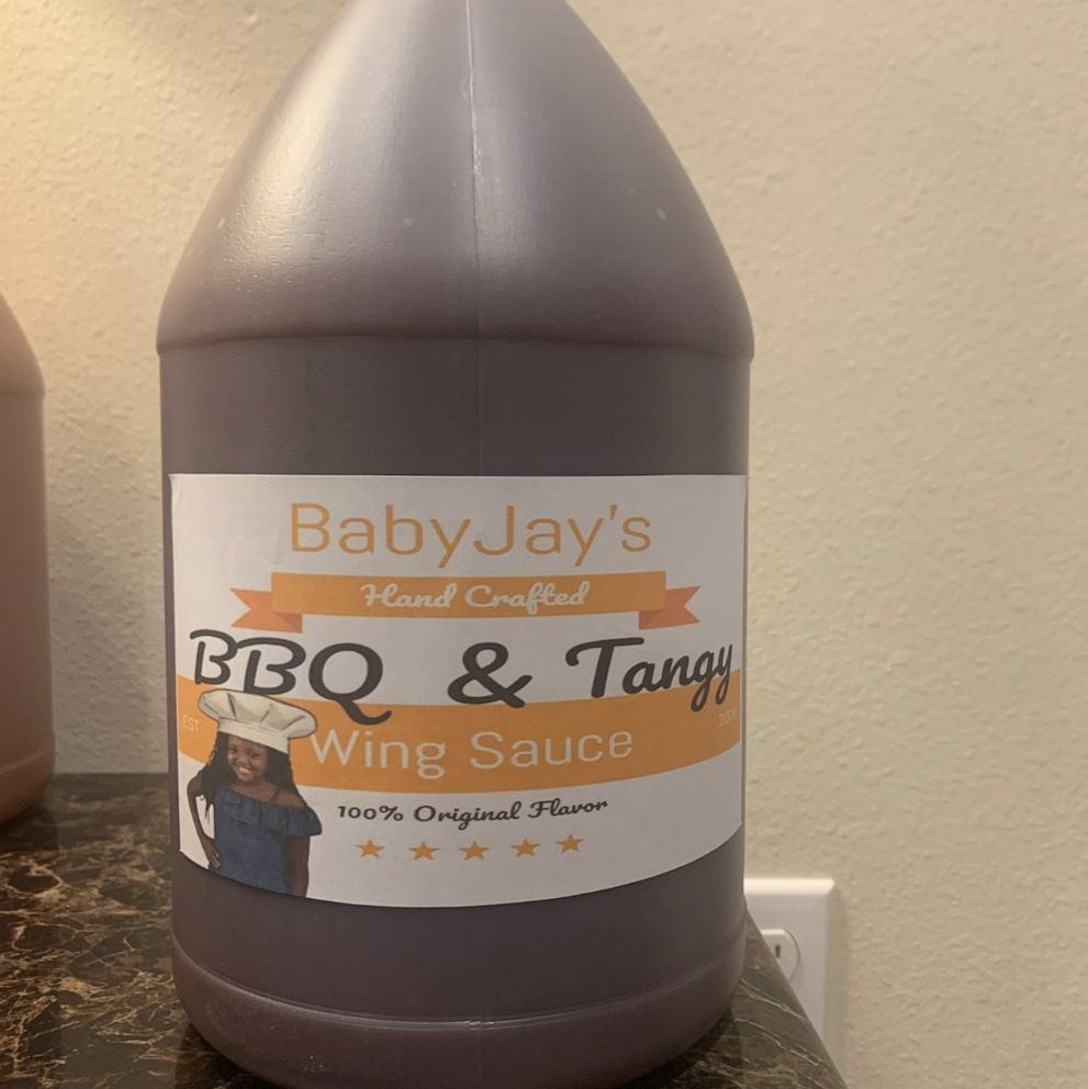 PHOTO: A'Jzala Johnson of Luling, Louisiana, has a top secret recipe that her customers wish they could get their hands on. When the pandemic hit, the 12-year-old began experimenting. BabyJay’s Wing Sauce comes in two flavors: BBQ & Tangy and Hot & Spicy.