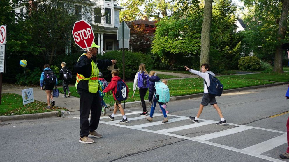 PHOTO: On Sept. 10, 2019, Alec Childress was met with 100 kids, parents, family and church members at the intersection where he's been crossing students in Wilmette, Illinois, for 14 years.