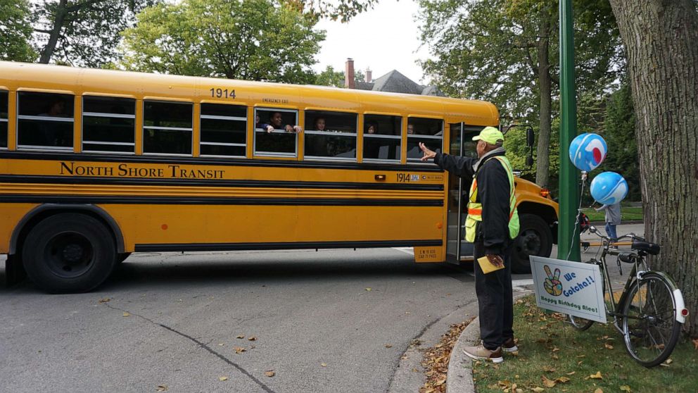 PHOTO: On Sept. 10, 2019, Alec Childress was met with 100 kids, parents, family and church members at the intersection where he's been crossing students in Wilmette, Illinois, for 14 years.