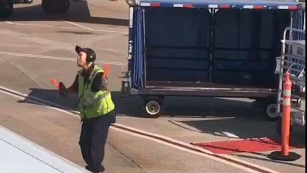 PHOTO: An airline worker at Nashville International Airport was seen dancing on the tarmac.