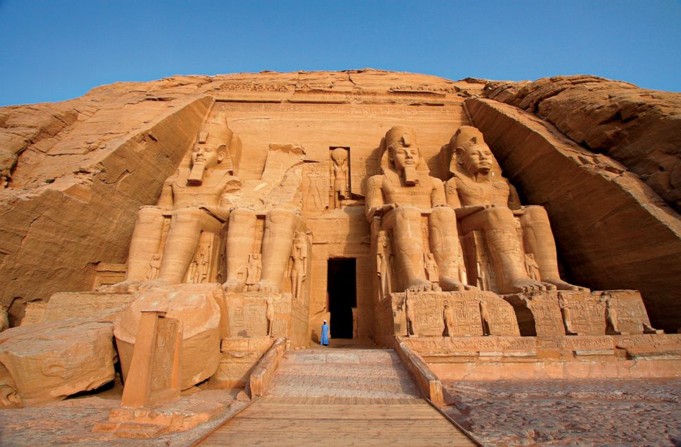 Colossal statues of Egyptian pharaoh Ramses II guard the entrance to Abu Simbel's main temple.