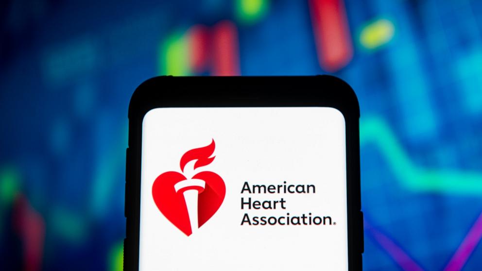 PHOTO: In this photo illustration an American Heart Association logo seen displayed on a smartphone, March 23. 2020.