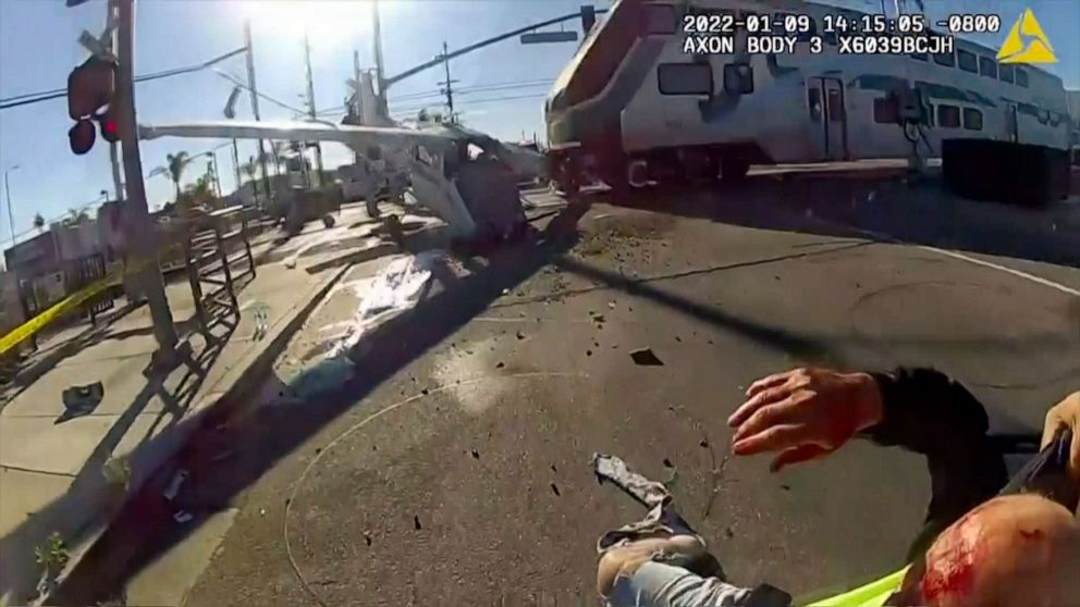 In this screengrab from a body cam video provided by the LAPD, a commuter train crashes with a plane. LAPD officers pulled a pilot from the plane that crash-landed just moments before a commuter train smashed into the aircraft over the weekend. 