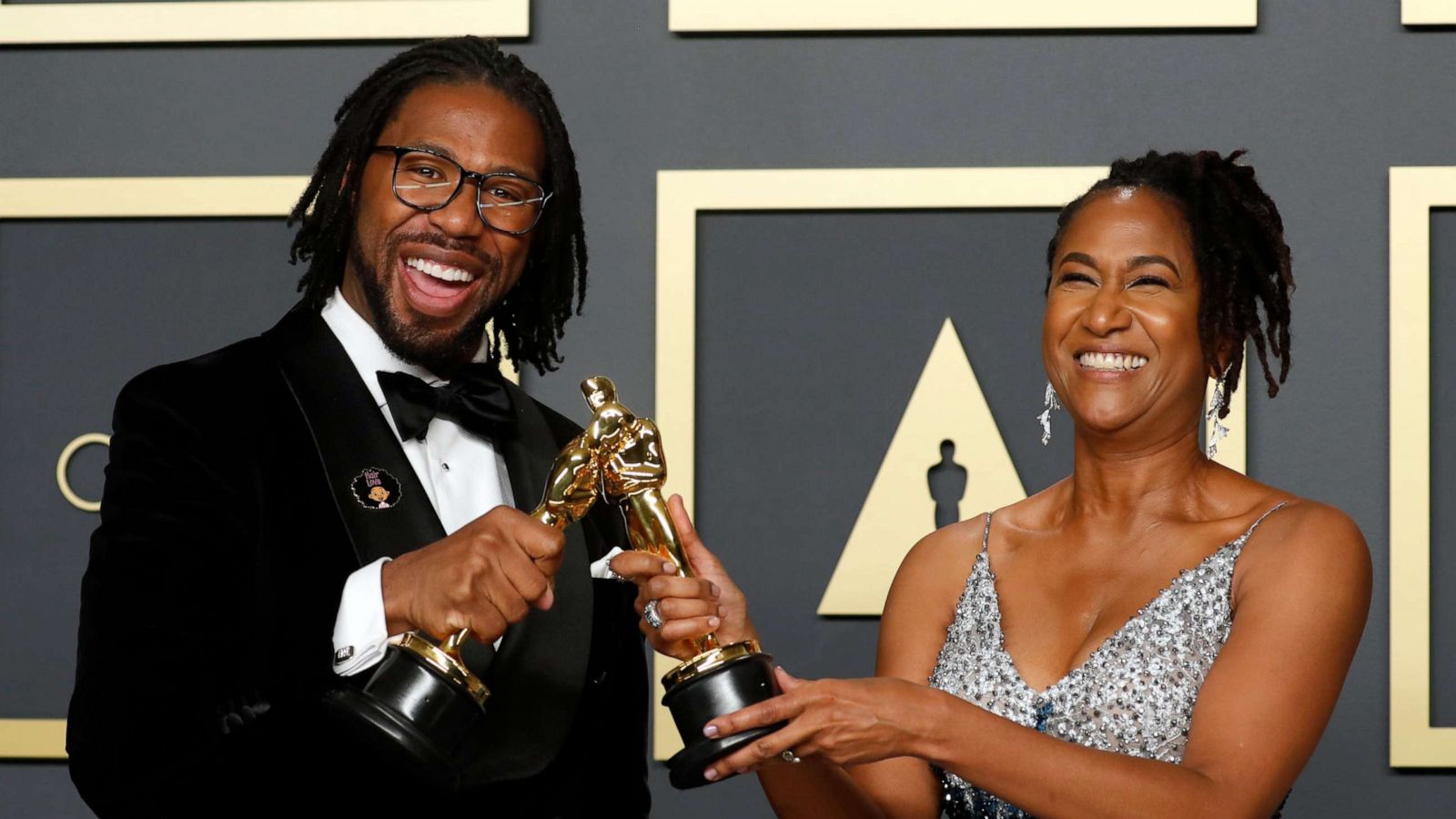 PHOTO: Matthew A. Cherry and Karen Rupert Toliver pose with the Oscar for Best Animated Short Film for "Hair Love" in the photo room during the 92nd Academy Awards in Hollywood, Los Angeles, California, U.S., February 9, 2020. REUTERS/Lucas Jackson