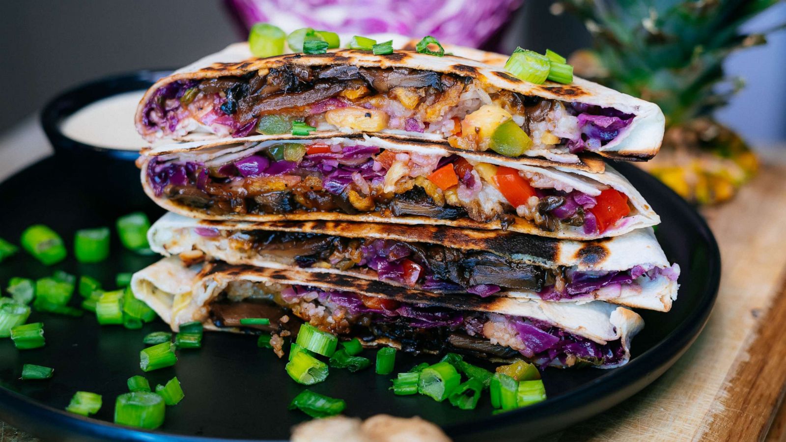 PHOTO: A loaded Caribbean crunchwrap with Jamaican rice and peas and jerk marinated mushrooms.