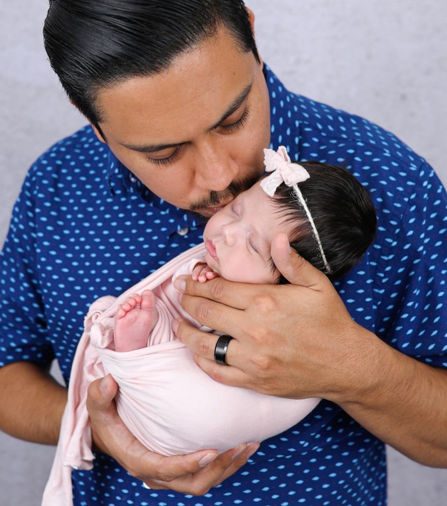 PHOTO: James Alvarez holding his daughter Adalyn.