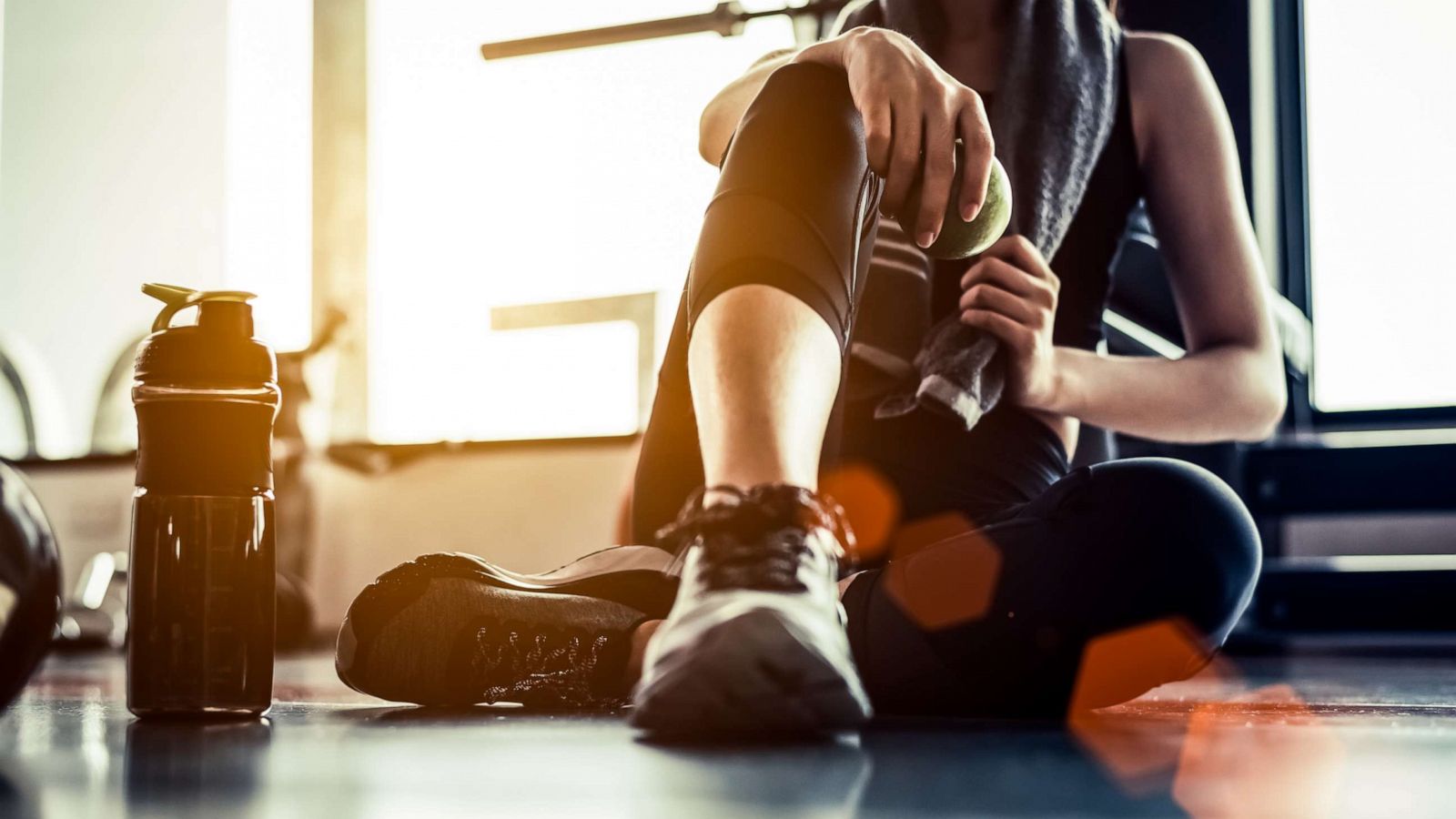 PHOTO: A woman sitting and resting after a workout.