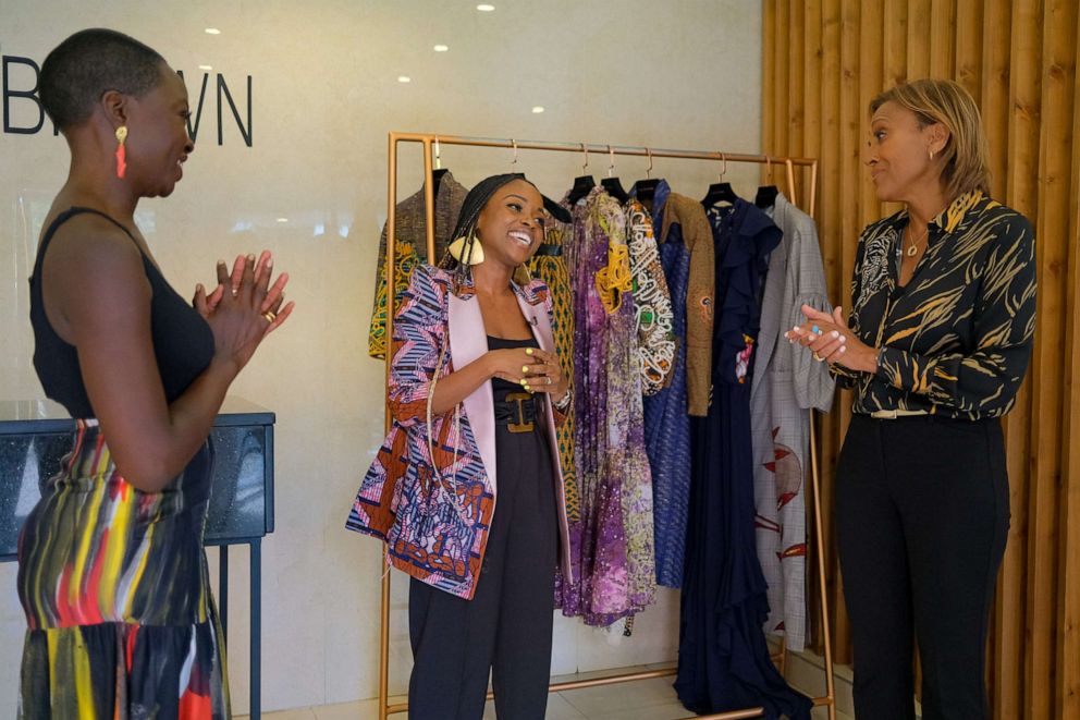 PHOTO: Good Morning America's Robin Roberts (right) interacts with Danai Gurira (left) and Christine (middle) at the Christine Brown fashion boutique on Tuesday, Sept. 27, 2022 in Accra, Ghana. (Nipah Dennis AP Images for Good Morning America)