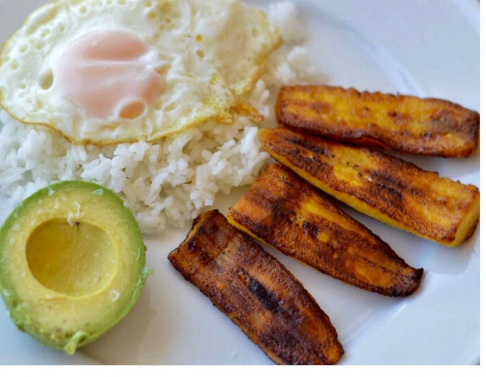 PHOTO: A plate of rice with eggs and plantains.