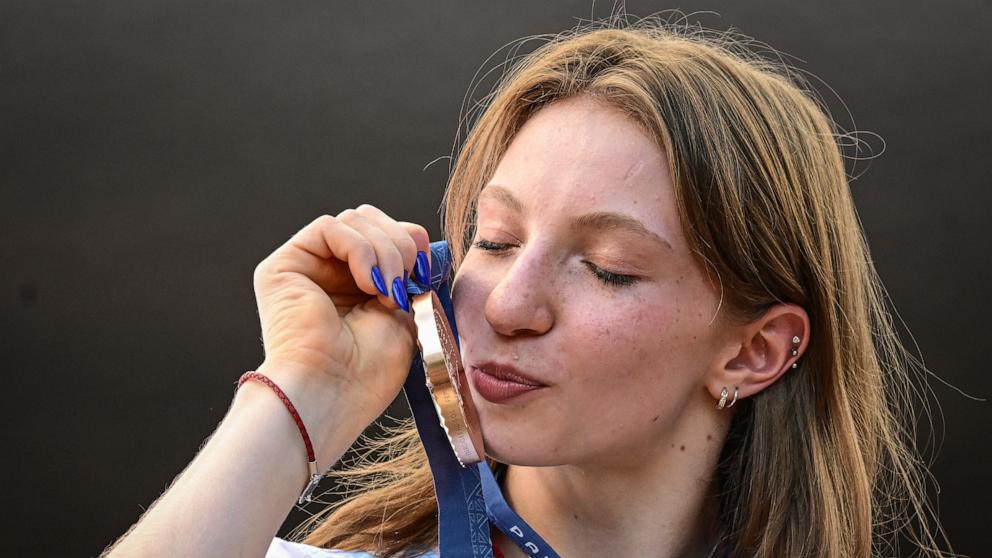 PHOTO: Romanian gymnast Ana Maria Barbosu poses with her Olympic bronze medal she was given, Aug. 16, 2024, in Bucharest, Romania.