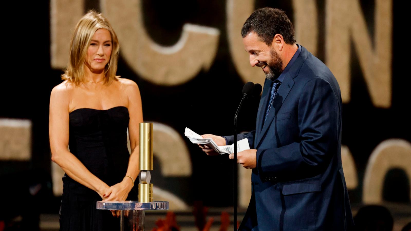 PHOTO: Jennifer Aniston presents Adam Sandler with the People's Icon Award during the 2024 People's Choice Awards in Santa Monica, CA, Feb. 18, 2024.