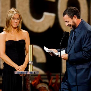 PHOTO: Jennifer Aniston presents Adam Sandler with the People's Icon Award during the 2024 People's Choice Awards in Santa Monica, CA, Feb. 18, 2024.