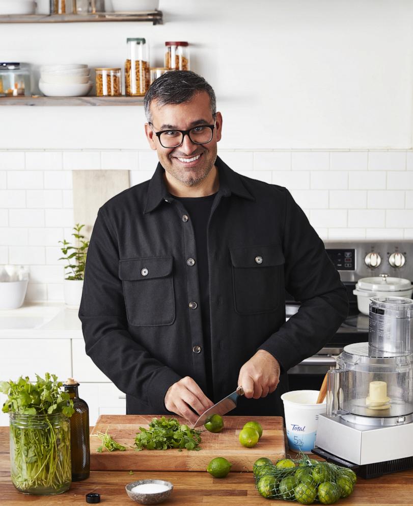 PHOTO: Arash Hashemi slices limes and herbs for a recipe from his new cookbook.