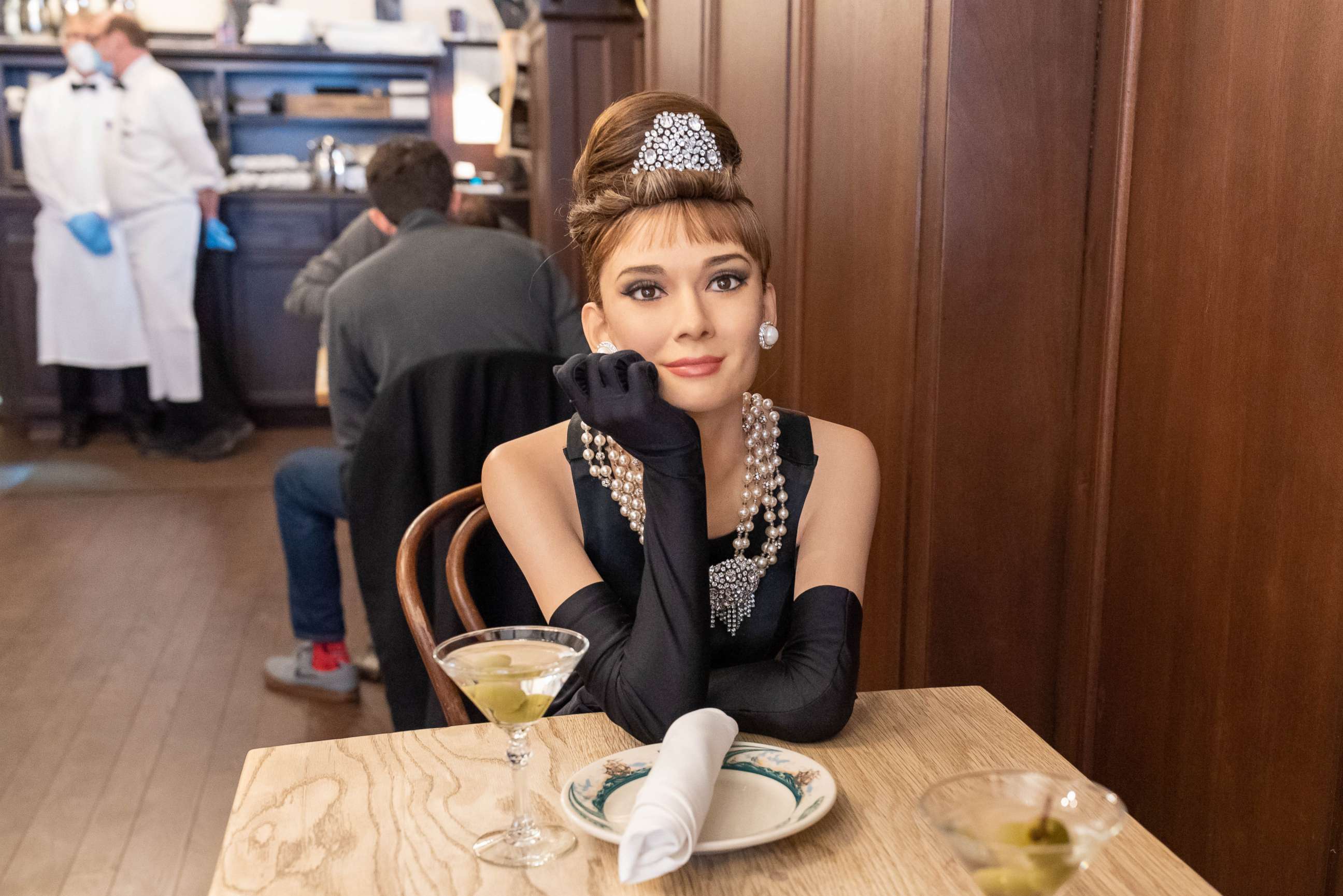 PHOTO: A wax figure of Audrey Hepburn sits inside Peter Luger Steak House.