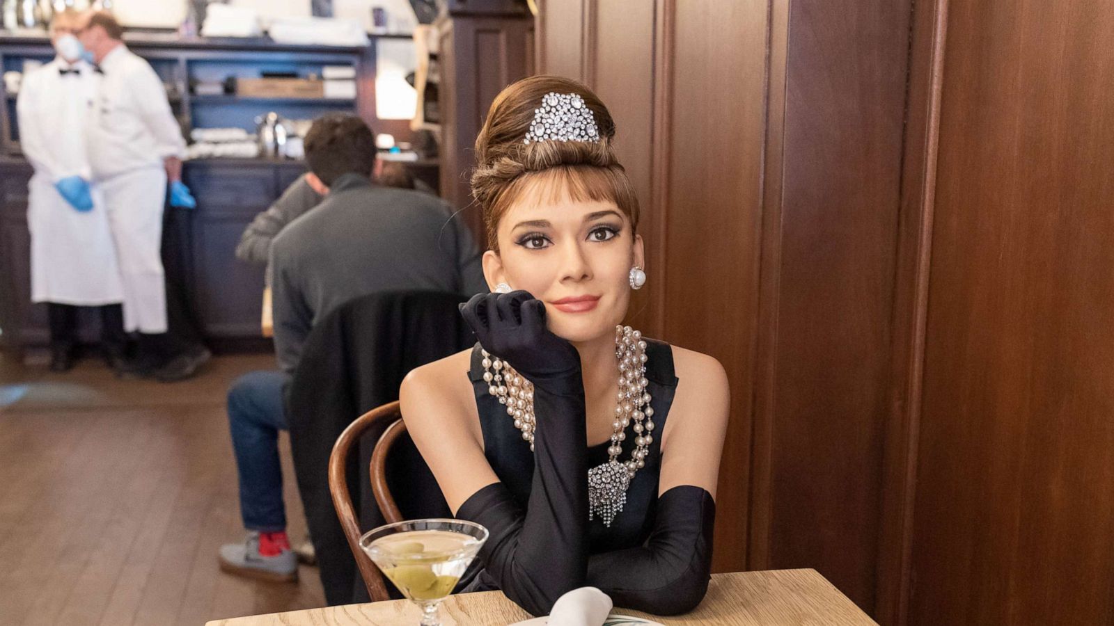 PHOTO: A wax figure of Audrey Hepburn sits inside Peter Luger Steak House.