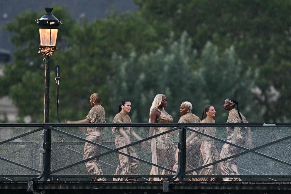 PHOTO: Singer Aya Nakamura and dancers perform on the Pont des Arts footbridge during the opening ceremony of the Paris 2024 Olympic Games in Paris, July 26, 2024. 