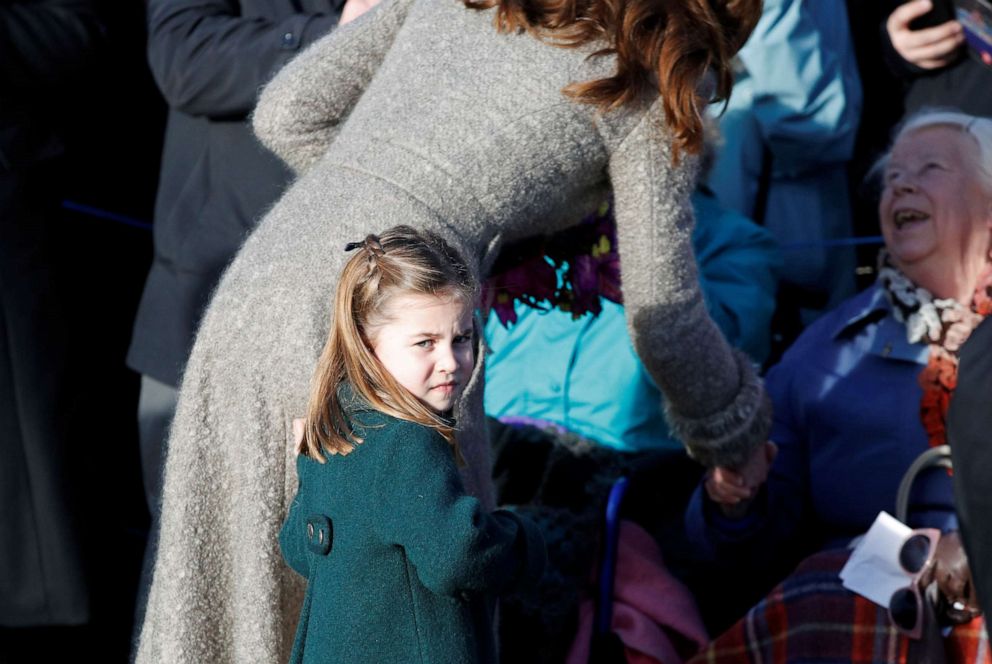PHOTO: Catherine, Duchess of Cambridge and Princess Charlotte greet people as they leave the St Mary Magdalene's church after the Royal Family's Christmas Day service on the Sandringham estate in eastern England, Britain, Dec. 25, 2019.