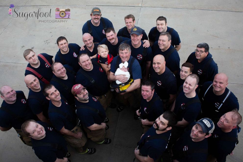 PHOTO: Grandfather, Jack Korves, holds baby Brett with the Swansea Fire Department.