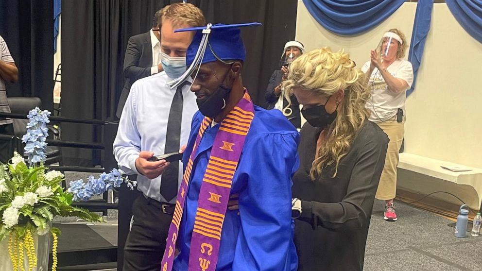VIDEO: Paralyzed football player walks across stage to get diploma