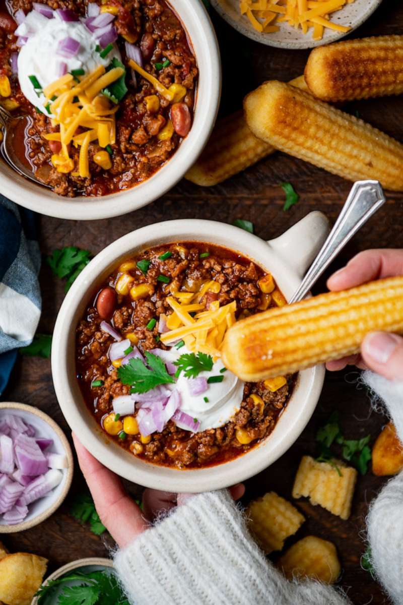 PHOTO: Bowls of beef chili topped with sour cream, red onions and shredded cheese.