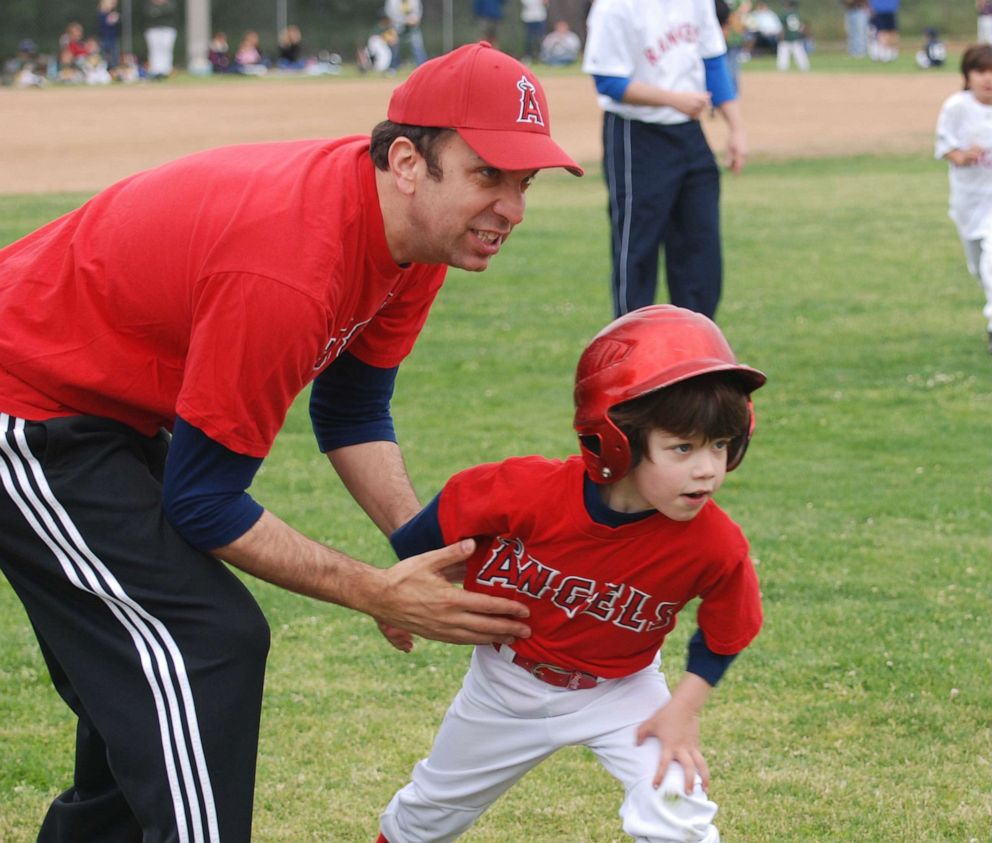 PHOTO: MOJO founder and CEO Ben Sherwood with his son playing little league baseball.