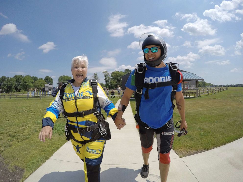 PHOTO: Beverly Mylek, 78, walking to the plane she will jump from momentarily. 