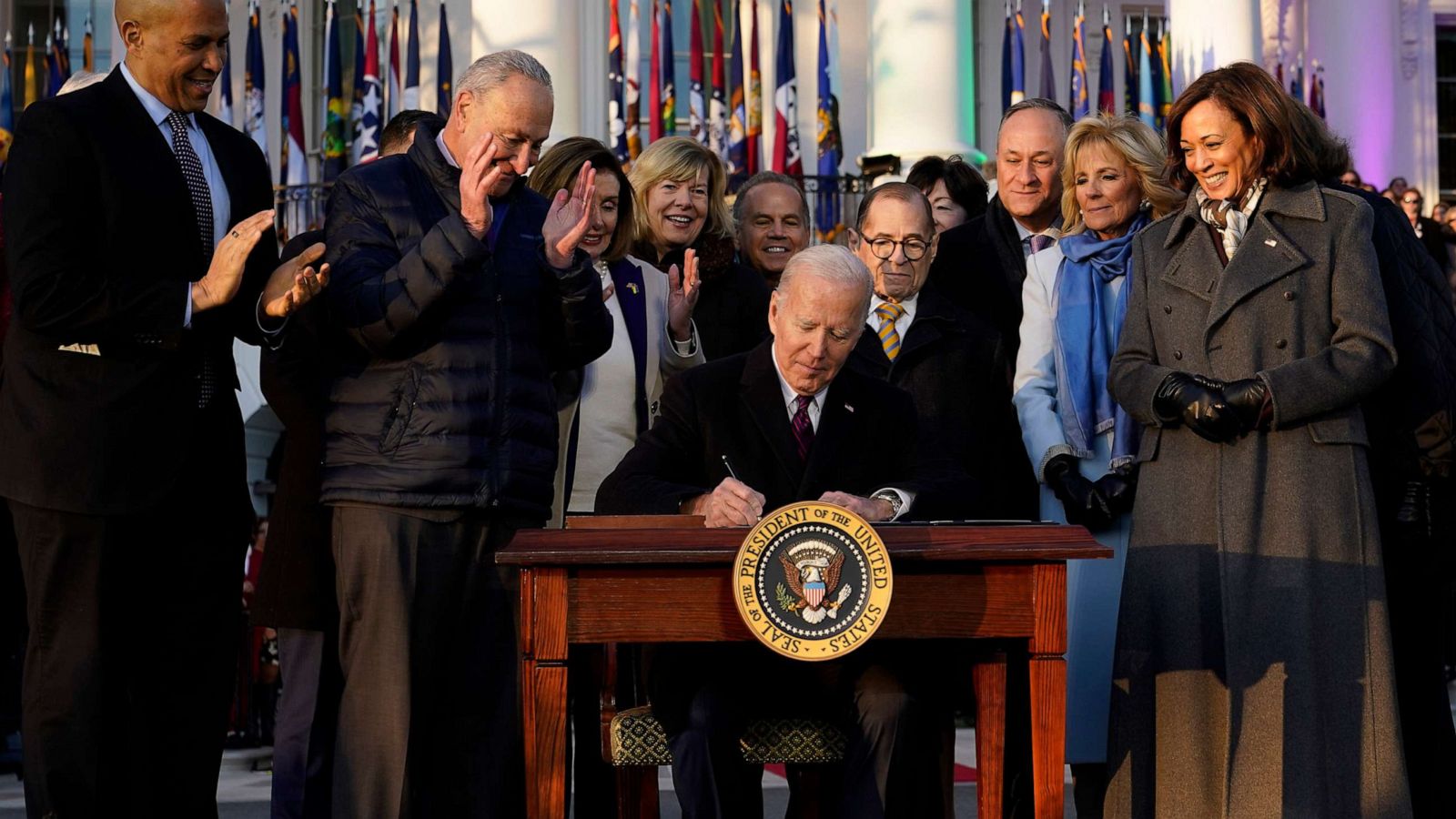 PHOTO: President Joe Biden signs the Respect for Marriage Act, Dec. 13, 2022, on the South Lawn of the White House.