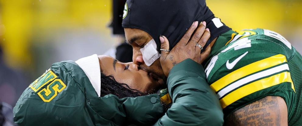 PHOTO: Olympic gold medalist Simone Biles kisses husband Jonathan Owens #34 of the Green Bay Packers before the game between the Kansas City Chiefs and the Green Bay Packers at Lambeau Field on Dec. 3, 2023 in Green Bay, Wisc.