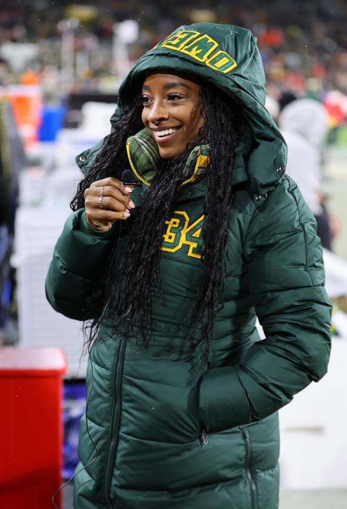 PHOTO: Olympic gold medalist Simone Biles looks on before the game between the Kansas City Chiefs and the Green Bay Packers at Lambeau Field on Dec. 3, 2023 in Green Bay, Wisc.