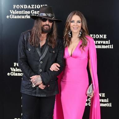 Billy Ray Cyrus and Elizabeth Hurley attend the "Orizzonti | Rosso" Exhibition Opening Dinner on May 24, 2025 in Rome, Italy. 