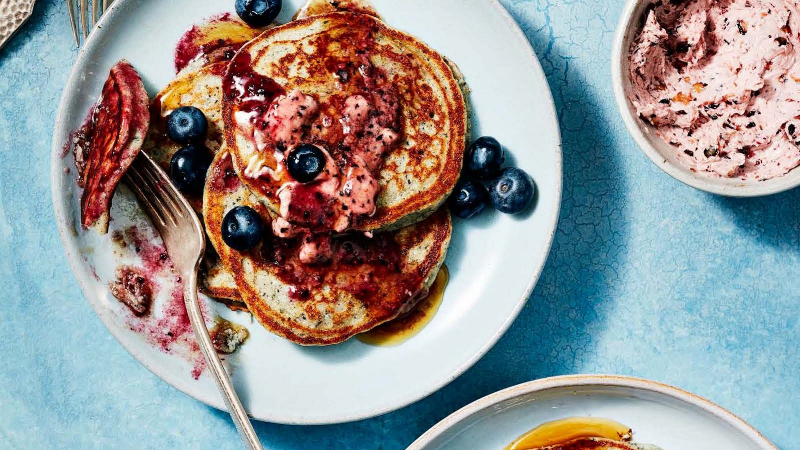 PHOTO: A stack of blue cornmeal pancakes with blueberry butter.