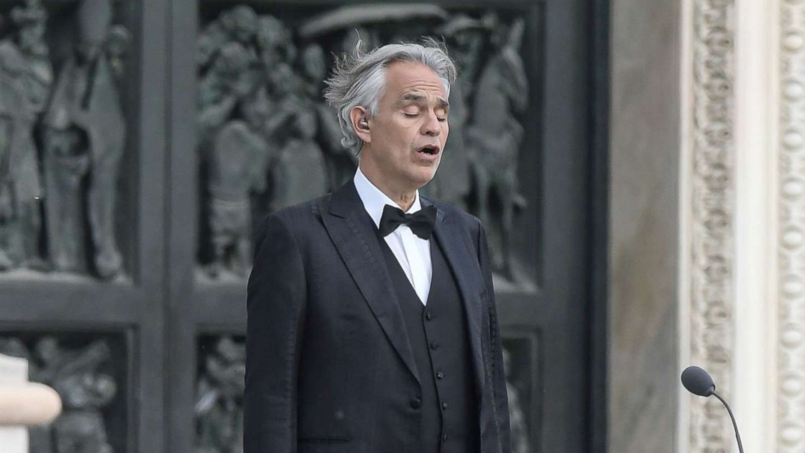 PHOTO: Andrea Bocelli sings during a rehearsal on a deserted Piazza del Duomo in central Milan, April 12, 2020.