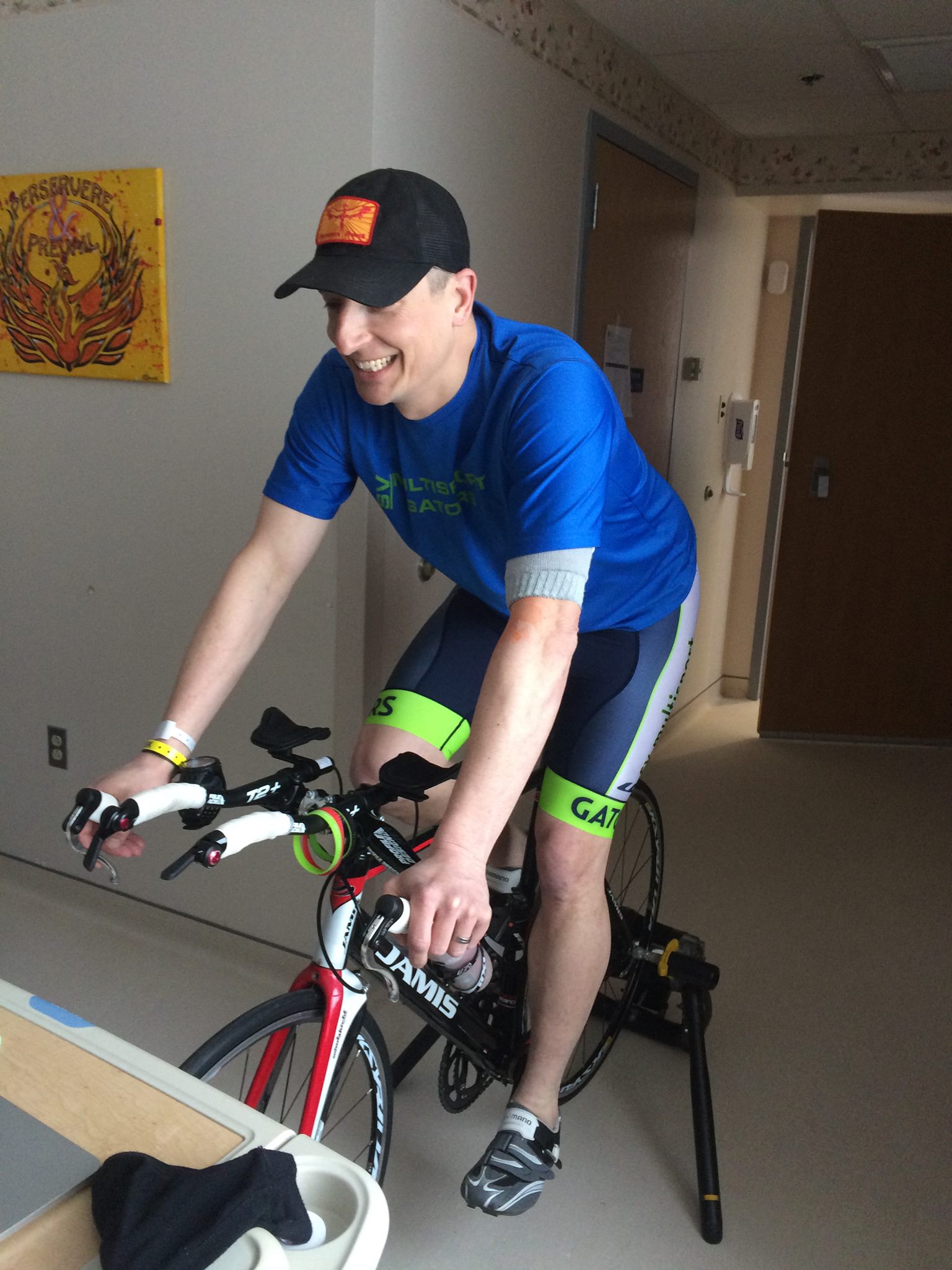 PHOTO: Brian Kozera rides a bike in his hospital room.