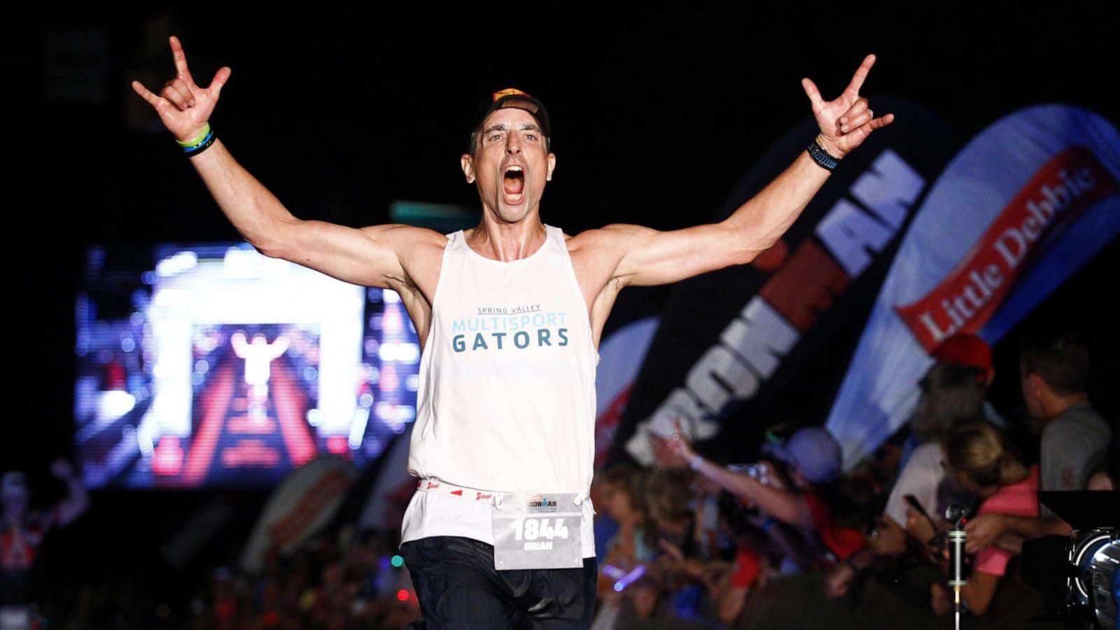 PHOTO: Brian Kozera crossing finish like at Lake Placid Ironman.