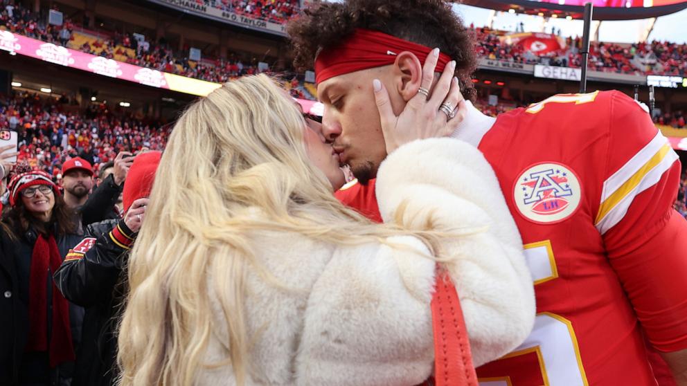 PHOTO: Patrick Mahomes kisses wife, Brittany Mahomes, prior to the AFC Championship Game against the Buffalo Bills at GEHA Field at Arrowhead Stadium, Jan. 26, 2025, in Kansas City, Mo.