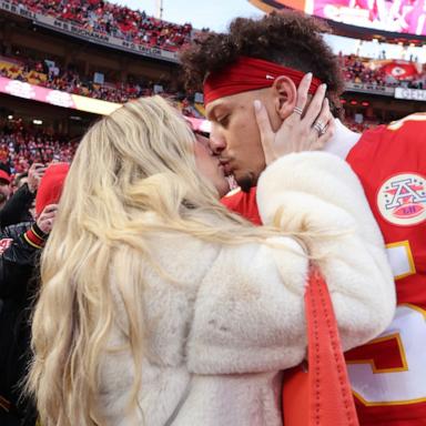 PHOTO: Patrick Mahomes kisses wife, Brittany Mahomes, prior to the AFC Championship Game against the Buffalo Bills at GEHA Field at Arrowhead Stadium, Jan. 26, 2025, in Kansas City, Mo.