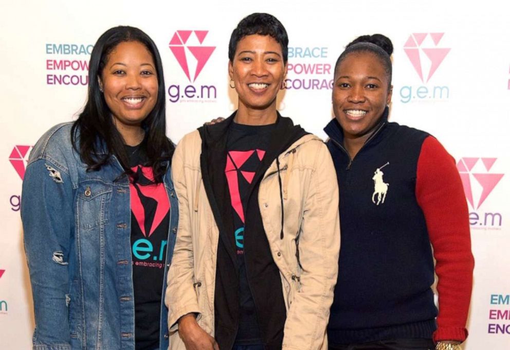 PHOTO: Brittany Barnett, far left, poses with her mother, center, and sister at an event for Girls Embracing Mothers (GEM), the charity she founded.